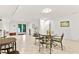 Basement area featuring a dining table set and a door leading to the backyard at 106 Palomino Cv, Louisburg, NC 27549