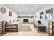 Finished basement features a cozy fireplace, recessed lighting, and tile flooring at 106 Palomino Cv, Louisburg, NC 27549