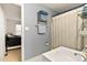 Powder blue bathroom with white fixtures and a shower curtain at 106 Palomino Cv, Louisburg, NC 27549
