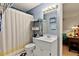 Cozy bathroom with hexagon tile flooring, vanity and shower at 106 Palomino Cv, Louisburg, NC 27549