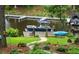 Backyard dock featuring boat and kayak near the house at 106 Palomino Cv, Louisburg, NC 27549