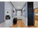 Welcoming entryway with hardwood floors, wainscoting, and a unique chalkboard wall for messages at 106 Palomino Cv, Louisburg, NC 27549