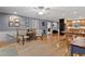 Open-concept living space with hardwood floors, neutral tones, and convenient access to kitchen at 106 Palomino Cv, Louisburg, NC 27549