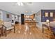 Living area with hardwood floors connecting kitchen, dining, and other living spaces, perfect for gatherings at 106 Palomino Cv, Louisburg, NC 27549