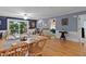 Open concept living area featuring hardwood floors, dining space, and easy access to bedrooms at 106 Palomino Cv, Louisburg, NC 27549