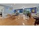 Spacious and sunny living area with hardwood floors, dining table and access to back deck at 106 Palomino Cv, Louisburg, NC 27549