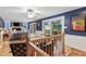 Living room with water views, hardwood floors, staircase and a fireplace at 106 Palomino Cv, Louisburg, NC 27549