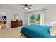 Bright bedroom with sliding doors that lead to a balcony area at 106 Palomino Cv, Louisburg, NC 27549