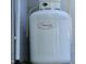 Close up of a large white propane tank, ensures energy efficiency and utility independence at 106 Palomino Cv, Louisburg, NC 27549