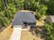 Stunning aerial view of a modern home with lush surrounding greenery and a spacious driveway at 107 Seminole Dr, Louisburg, NC 27549