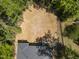 Bird's eye view capturing the backyard and a home featuring a porch with stairs leading down to the yard at 107 Seminole Dr, Louisburg, NC 27549