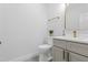 Modern bathroom features light grey cabinets and gold fixtures with fresh paint at 107 Seminole Dr, Louisburg, NC 27549
