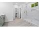 Bathroom boasts a walk-in shower featuring beautiful marble tile, a built-in niche, and gold hardware at 107 Seminole Dr, Louisburg, NC 27549