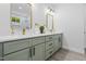 Bathroom features double sink vanity with stylish mirrors, light fixtures, and modern decor at 107 Seminole Dr, Louisburg, NC 27549
