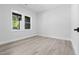 Bright bedroom features sleek flooring, ample natural light, and fresh paint at 107 Seminole Dr, Louisburg, NC 27549