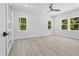 Spacious bedroom with three windows offers ample natural light and views of the outdoors at 107 Seminole Dr, Louisburg, NC 27549