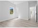 Bright bedroom with modern flooring, fresh paint, and a scenic view from the window at 107 Seminole Dr, Louisburg, NC 27549