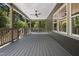 Long, covered back deck overlooking trees at 107 Seminole Dr, Louisburg, NC 27549