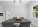 Elegant dining room featuring a chandelier, and decorative wall paneling at 107 Seminole Dr, Louisburg, NC 27549