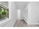 Bright and airy entryway with bench, storage, and scenic view from the window at 107 Seminole Dr, Louisburg, NC 27549