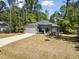 Lovely exterior of the home displaying a stone-detailed garage and a paved driveway at 107 Seminole Dr, Louisburg, NC 27549