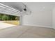 Spacious garage with an automatic door at 107 Seminole Dr, Louisburg, NC 27549