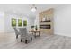Inviting living room with modern fireplace, ample natural light, and comfortable seating for relaxing at 107 Seminole Dr, Louisburg, NC 27549