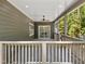 Relaxing covered porch featuring ceiling fan, and sliding glass doors leading to the outdoors at 107 Seminole Dr, Louisburg, NC 27549