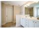 Bright bathroom with white cabinets and a tiled floor at 11 Piccadilly Ct, Durham, NC 27713