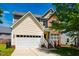 Charming two-story home with a mix of brick and siding, complemented by an attached two-car garage and a well-maintained lawn at 11 Piccadilly Ct, Durham, NC 27713