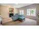 Living Room with carpet floors, a fireplace, and views from the windows at 11 Piccadilly Ct, Durham, NC 27713