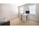Bright office space featuring a white desk and neutral carpeting at 11 Piccadilly Ct, Durham, NC 27713