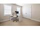Dedicated office space with bright windows, white desk, and neutral carpet at 11 Piccadilly Ct, Durham, NC 27713