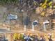 Aerial view of several residential homes surrounded by wooded land at 1101 Ridge Rd, Roxboro, NC 27573