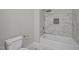 Bathroom features a bathtub with marble tile and gold fixtures at 1101 Ridge Rd, Roxboro, NC 27573
