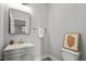 Charming powder room features modern vanity, sleek faucet, and framed mirror at 1101 Ridge Rd, Roxboro, NC 27573