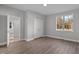 Bedroom with neutral decor, wood-look floors, closet and ensuite access at 1101 Ridge Rd, Roxboro, NC 27573