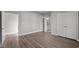 Spacious bedroom features wood floors, ensuite bathroom and double door closet at 1101 Ridge Rd, Roxboro, NC 27573