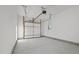 Spacious garage with concrete floor and overhead door at 1101 Ridge Rd, Roxboro, NC 27573