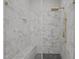 Modern shower features marble tiling, glass door, and gold fixtures at 1101 Ridge Rd, Roxboro, NC 27573
