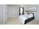 Bedroom features a plush bed, stylish floor lamp, and window with elegant blue curtains at 1106 Red Crest Ln, Durham, NC 27704
