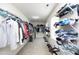 Walk-in closet with extensive shelving and storage, perfect for organizing clothes and accessories at 1106 Red Crest Ln, Durham, NC 27704