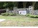 Stone monument entrance to Cardinal Lake features a landscaped sign at 1106 Red Crest Ln, Durham, NC 27704
