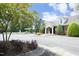 Clubhouse exterior has manicured landscaping, offering a serene community space in Durham, North Carolina at 1106 Red Crest Ln, Durham, NC 27704