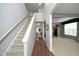Bright foyer showcasing hardwood floors, a staircase, and an open view to the living areas at 1106 Red Crest Ln, Durham, NC 27704