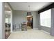 Open-concept living area with a view to the dining area and a wet bar at 1106 Red Crest Ln, Durham, NC 27704