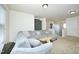 Spacious living room with a large, comfortable sectional and a unique, natural-edge coffee table at 1106 Red Crest Ln, Durham, NC 27704