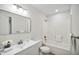 Bright bathroom featuring a shower-tub, modern vanity, and neutral color palette at 112 Carmichael Ct, Cary, NC 27511