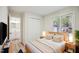 Bedroom with a bed, window, and closet; bathroom is accessible from the bedroom at 112 Carmichael Ct, Cary, NC 27511