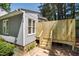 Home exterior featuring a private patio with steps and a well-maintained yard at 112 Carmichael Ct, Cary, NC 27511